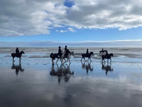 Riders on Whanganui beach