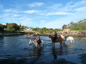 Riders crossing water